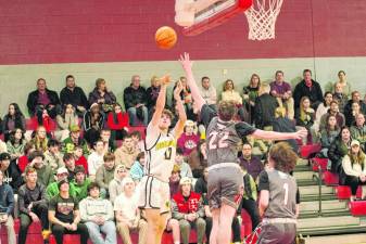 West Milford’s Ognjen Ljusic launches the ball from afar during the game Feb. 21 against High Point. The Highlanders lost, 51-47, in the opening round of the NJSIAA North Jersey, Section 1, Group 2 tournament. (Photos by George Leroy Hunter)