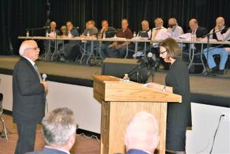 Green Meadow Organics Engineer Stephen Boswell, left, answers a question from an attorney objecting to the application at the Zoning Board hearing Tuesday night in the West Milford High School auditorium.