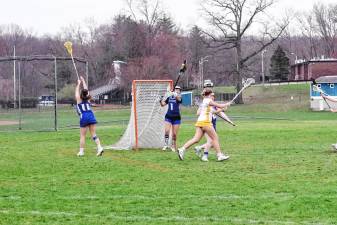 Kittatinny goalie Sophia Belardo (1) intercepts the ball with her crosse, preventing a point for Vernon in the game Thursday, April 3. The Vikings won, 7-5. Belardo made four saves. (Photos by George Leroy Hunter)