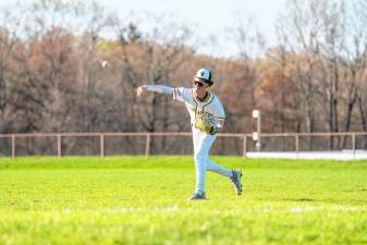 Junior Jack Lizza tosses the ball to first in the game against Lakeland on April 23. West Milford won, 9-3. (Photos by TJ Nolan)