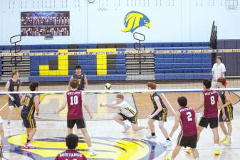 Jefferson's Andrew Mohlenhoff performs a dig during a volleyball match against Clifton on May 15. He executed 14 digs, including the 1000th dig of his career. Jefferson won, 2-0. (Photos by George Leroy Hunter)