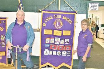 Charles Chuck Enering, left, at the Lions Club Health fair in April 2019. ( File photo)