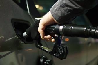 Gasoline prices dropped a penny a gallon for the second week in a row. Still, motorists are paying $1.09 more for a gallon of gas today than a year ago. Photo illustration.