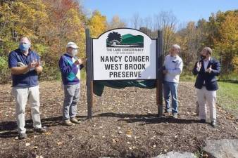 Pictured from left to right are: Andy Dietz, Land Conservancy Chair of the Board; Bill Conger; Land Conservancy President David Epstein; and U.S. Rep. U.S. Rep. Josh Gottheimer at the dedicated of the Nancy Conger West Brook Preserve in 2019. File photo.