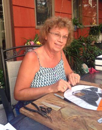 Susan Schrier, owner of Stained Glass Pro, works on one of her next creations.