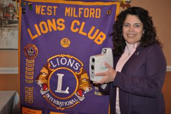 Barbara Cosaro of the West Milford Lions Club is seen with equipment used to screen young children for eye problems. Photo Courtesy West Milford Lions Club