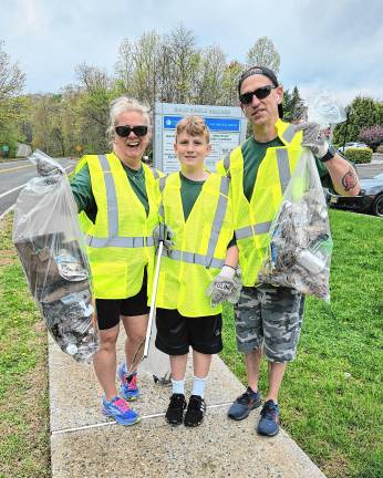 BD1 The Schouten family of West Milford with trash they picked up along Cahill Cross Road as part of the township’s Beautification Day on Saturday, April 26. (Photos by Rich Adamonis)