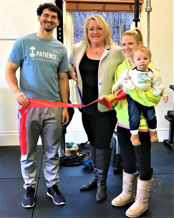 Submitted photos Mayor Michele Dale helps P&amp;C Fitness Center owners Justin Florio and Allison Barrett cut the ribbon to open their new fitness business on Route 23 Dec. 17.