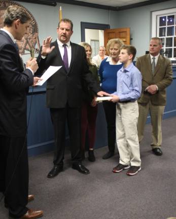 Newly-minted Councilman Peter McGuinness takes the oath of office Wednesday night. Assemblyman Jay Webber did the swearing in, with McGuinness' family nearby, including daughter Mackenzie, son Seamus, mom Patricia and brother Brian.