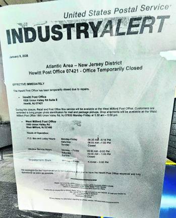 Notice of closure is posted on the windows of the Hewitt Post Office, referring customers to the West Milford Post Office.