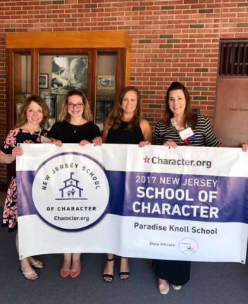 Photo provided Members of the Paradise Knoll staff celebrated the state School of Character designation.