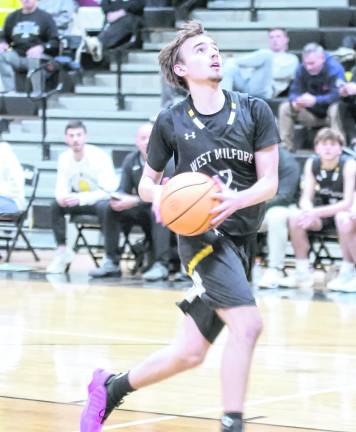 West Milford's Logan Deaver handles the ball during a fast break play. Deaver scored 12 points.