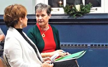 Charles Kim photo Resident Carol Hardy, left, speaks to ousted Township Administrator Antoinette Battaglia during Wednesday night's Township Council meeting.