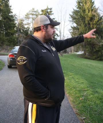 Randy Saracco points to the site as he talked about what happened the night he pulled a woman from a pond off Union Valley Road.