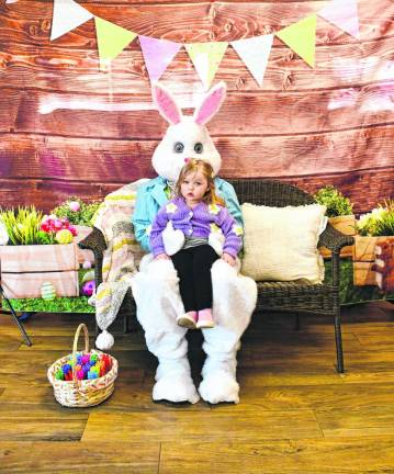 Tenley Crane of Vernon sits on the Easter Bunny’s lap at the breakfast hosted by hosted by Branchville Hose Company #1 on Sunday, March 3. (Photo by Maria Kovic)