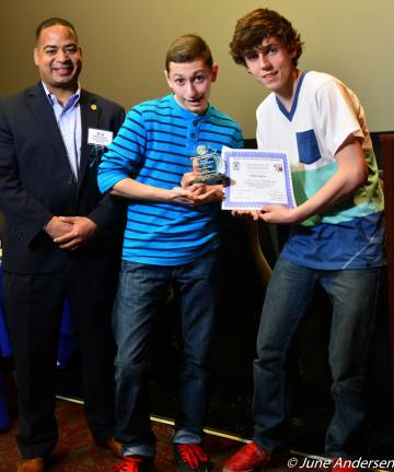 Frankie Lagana of West Milford High School, center, with a friend, is congratulated by Passaic County Freeholder Director Hector Lora for his third place award for High School Short Film titled &#x201c;One With WiFi&#x201d; at the Passaic County Film Festival.