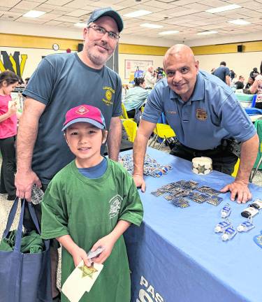 Father and son, both named Francis Gensheimer, pose with a police officer.