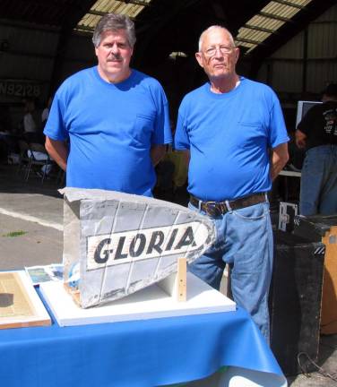 One of the interesting exhibits at Warwick Municipal Airport Tenant Appreciation Day in 2013 was the nose of the original “Gloria,” airmail rocket, launched from the ice on Greenwood Lake in 1936. From left, Pilot's Association President Mark Harrington and Airport Manager Dave Mac Millan,who passed away in 2020. Photo by Roger Gavan.