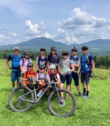 Coach Dave Kahl, at right, with some of the junior New Jersey NICA riders and a fellow coach at the second annual summer NICA camp week in Vermont’s Kingdom Trails. Sixty student athletes and a staff of more than 30 adults attended the camp this summer. (Photo provided)