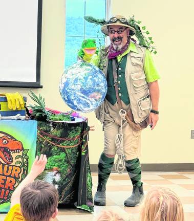 Professor Livingstone (David Engel) takes children on a dinosaur safari.