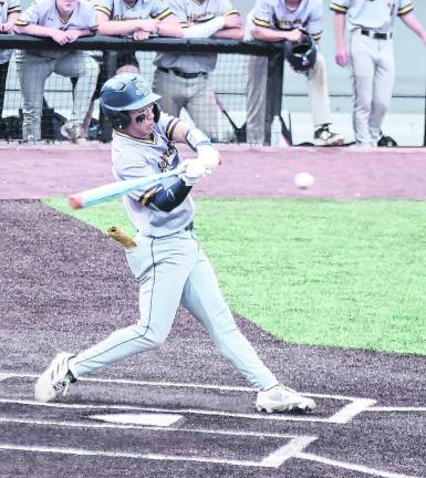 Jefferson batter Nick Do begins to swing the bat towards the ball.