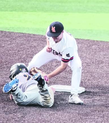In the third inning attempting to steal second base Jefferson's Nick Aiello is tagged out by Mountain Lakes infielder Brendan Duerr.
