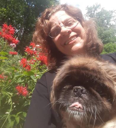 It’s Kerri Yezuit’s second Dry January. “I’m sleeping better, I’m more productive and I’m more of my authentic self to share with my family, friends and pets,” she said. Pictured: Kerri with her pup, Gizzy. Photo provided.
