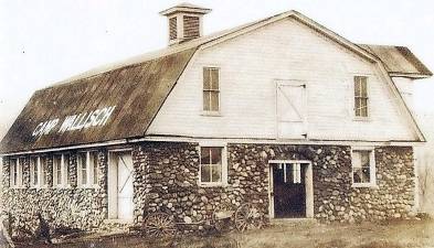 The Tischenor-Gregory-Goodell-Wallisch Homestead (known as the Wallisch Homestead) is one of the last remaining spaces that accurately reflect Northern New Jersey’s agricultural heritage and West Milford’s history. The 200-year old farmstead is located at 65 Lincoln Road. It has a 1912 Dutch Colonial Revival house with one wing dating before 1820, a Dutch Colonial Revival stone barn, an Arts-and Crafts style creamery from 1912, and two woodpost-and-beam barns. The three-acre famstead is owned by West Milford Township and the Board of Education. Source: Sustainable West Milford.