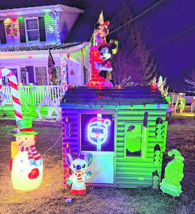 A snowman, Stitch, The Grinch and Mickey and Minnie Mouse are shown.