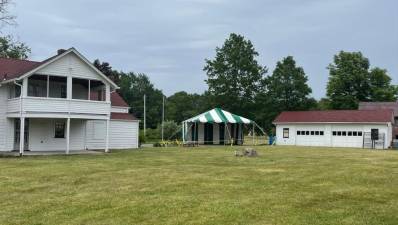 The green-and-white tent is set up at the Wallisch Homestead, 65 Lincoln Ave.