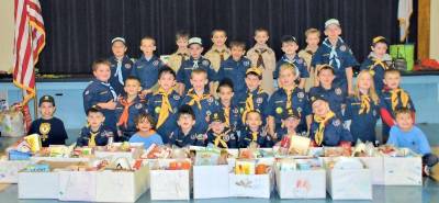Cub Scout Pack 9 brought boxes and bags of donated food to St. Joseph's Catholic Church Nov. 22.