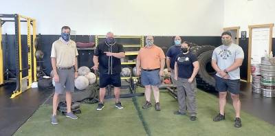 Assemblyman Colin J. Schmitt recently visited the Granite Barbell Gym in Hamptonburgh. Pictured from left to right are: Assemblyman Schmitt; Brett Somerville, co-owner Granite Barbell Gym, Tony Buzzeo, co-owner Granite Barbell Gym, Katie Carlino, head trainer and commander in Army Reserves, John Seymour, first responder, and Conrad Rosales, trainer and Army veteran. Provided photo.