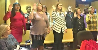 The new advocates pledge their oath of service.