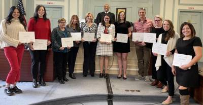 From left are Jeanette Schneider, Vanessa Patterson, Theresa Wislomerski, Helen Vera, Kelly Volpi, Teresa LeDonne, Kathleen McCarty, James Hubertus, Laura Evans-Harty, Carolyn Asch and Raquel Tumminelli. Behind them is Judge Michael Paul Wright, who swore in the CASA volunteers Dec. 8. (Photo provided)