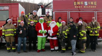 Thanks to the Upper Greenwood Lake Volunteer Fire Company 5 for escorting Santa to the Mount Laurel ball field last Sunday, Dec. 19. Looks like the Grinch tried very hard to squash the fun but Santa seems to have convinced him otherwise. Photo provided by Kitty Heuer.