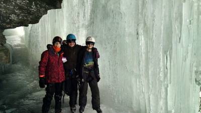 Connor Kopko, Andrew Holm and Shane Lucas observe the ice cavern.