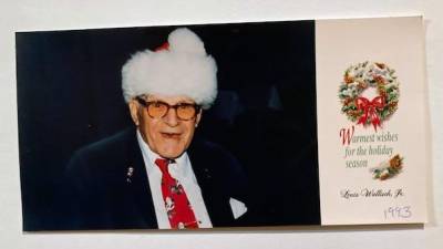 Wearing a Santa hat, Attorney Lou Wallisch sent his photo Christmas card to friends and associates in 1993. Photo provided.