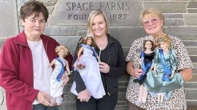 Lois Pellow of the New Jersey State Fair presents Caitlyn Space (center) and Lori Space Day (right) with limited edition Queen of the Fair Dolls (Photo provided)