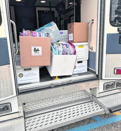 School supplies are shown in the back of an ambulance.