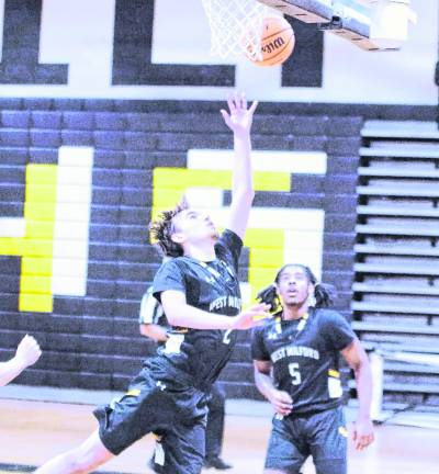 West Milford's Logan Deaver tosses the ball towards the hoop during a shot. Deaver scored 12 points.