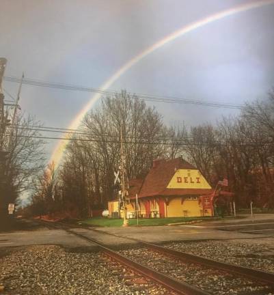 A rainbow appeared over The Tracks Deli, which has been providing free meals to those in need since mid-March.
