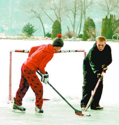 Photo by Ed Bailey Ice hockey on Greenwood Lake is one of the many winter activities available to residents to help keep them active and healthy.