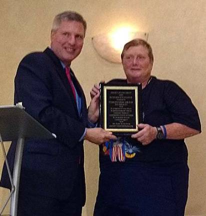 West Milford Councilwoman, Ada Erik, receiving the JAG Municipal Excellence Award from Mayor Brian Wahler of Piscataway, NJ.