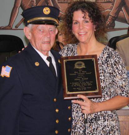 Adrian Birdsall, who has devoted 61 years to the West Milford Fire Department, was named recipient of the 2011 Mary B. Haase Lifetime Volunteer Award. Mayor Bettina Bieri presented him with the award in April. Photo by Linda Smith Hancharick.