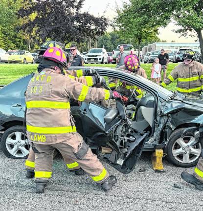 Firefighters demonstrate a vehicle extraction.