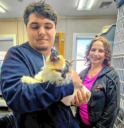 Joe Fabbo and Christine Szymanski team up to care for cats and kittens.