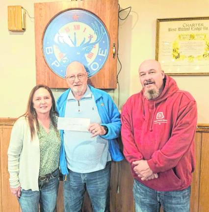 The West Milford Elks Lodge 2236 donated $1,079 to the West Milford Animal Shelter Society (WMASS) from raised at the Elks’ annual Cornhole Tournament. Pictured, from left, are the Elks’ Robin Logan, WMASS’ Paul Laycox, and Elks’ Kevin Goodsir.
