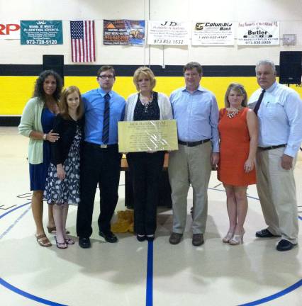 Bob Hansen's family - his wife, Ceil in center, his sons Brian and his friend Samantha, and Jeff and his wife Amy - along with Mayor Bettina Bieri, far left, and PAL President Bill Hemstead, far right, honored the late Hansen when the PAL Board of Directors unanimously named gym 3 at the building the Bob Hansen Gym.