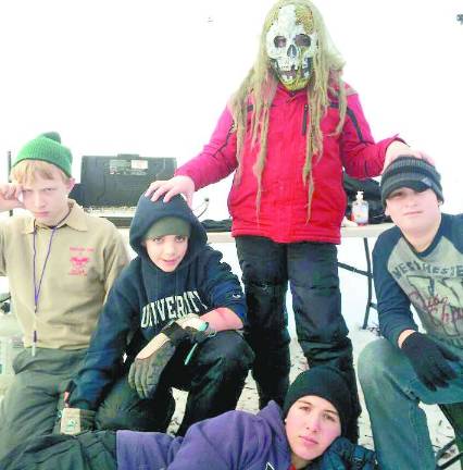 Zombie First Aid - Boy Scouts from Hewitt Troop 159 ran Raccoon City Hospital, one of the towns during the derby. Here they instructed and graded other scouts on first aid skills. Pictured here, from left, are Ben Butcher, E.J. Lindstrom, A.J. Bakunas, Dylan Chipman and the undead Ethan Bronson.