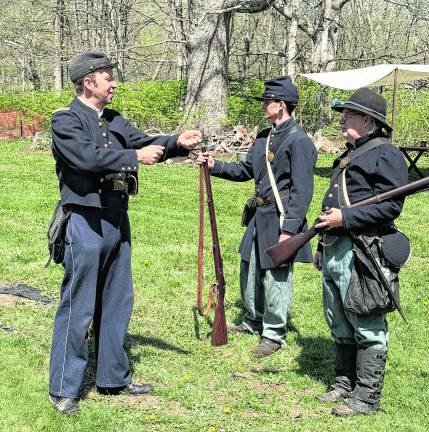 Proper rifle-holding technique is shown.